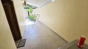 a view of a room with a patio with chairs at HomeVillas in Kuta Lombok