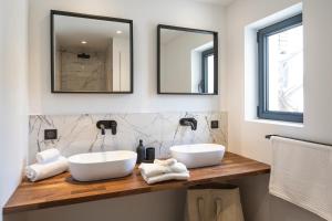 two sinks on a counter in a bathroom with two mirrors at Suite Île du Levant - Jardin & Piscine - 4 pers in La Croix-Valmer +8 photos