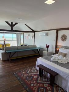 Ένα ή περισσότερα κρεβάτια σε δωμάτιο στο Loft Milagres +36 φωτογραφίες