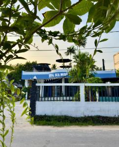 a building with a sign that reads jam sea mutual at Royal Sea Wind in Matara