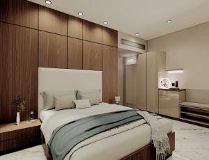 Una cama o camas en una habitación de Aceotel Premier Ujjayanta, Ujjain