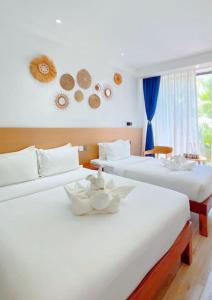 Ένα ή περισσότερα κρεβάτια σε δωμάτιο στο Fun Hotel