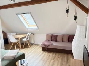 a living room with a couch and a table at Ferienwohnung Willi II in Spremberg