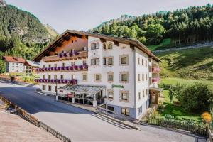 an aerial view of a hotel in the mountains at Hotel Grissemann in Flirsch
