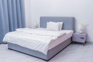 Ένα ή περισσότερα κρεβάτια σε δωμάτιο στο Sweet Apartment