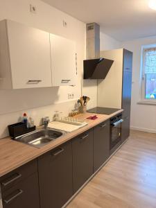 a kitchen with a sink and a counter top at La mia Casa in Bielefeld