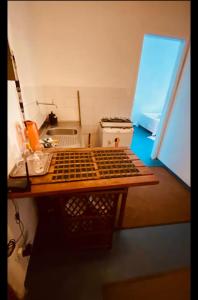 a small kitchen with a table and a sink at centro Historico Salvador in Salvador