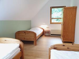 Ένα ή περισσότερα κρεβάτια σε δωμάτιο στο Natur Ferienpark 11 - Typ B