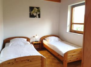 Postel nebo postele na pokoji v ubytování Natur Ferienpark 15 - Typ B