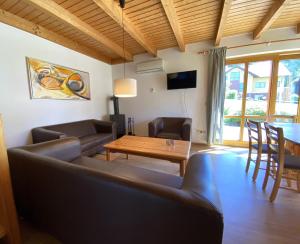 TV a/nebo společenská místnost v ubytování Natur Ferienpark 3 - Ferienhaus Typ C