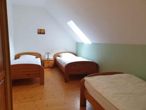 a room with two beds in a room at Natur Ferienpark 9 - Typ C in Nieheim