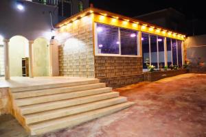 a building with stairs in front of a building with lights at Marina Privet chalet for rent in Al Jafr