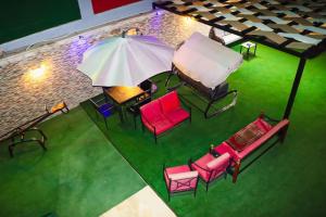 an overhead view of a group of chairs and an umbrella at Marina Privet chalet for rent in Al Jafr