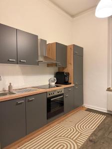 Kuchyň nebo kuchyňský kout v ubytování Citylife Apartment + 10 fotografií