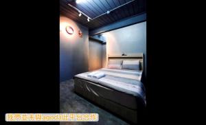 Postel nebo postele na pokoji v ubytování 新橙居-我們未與阿狗打訂房平台合作請勿在阿狗打訂房平台訂房