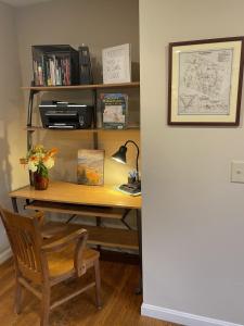 an office desk with a lamp and a chair at Unique Ski Rental in Berkshires Charlemont Near Hawley State Forest, Plainfield, Western Massachusetts in Plainfield