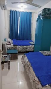 Postel nebo postele na pokoji v ubytování Sun City