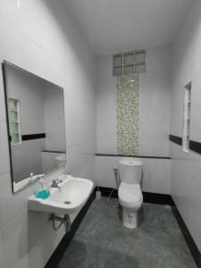 a bathroom with a white toilet and a sink at Krabi Rooms - Appartment 6 in Krabi town