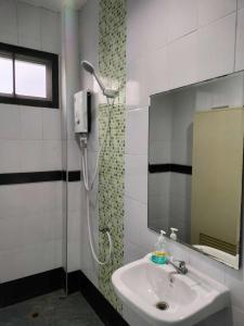 a bathroom with a shower and a sink at Krabi Rooms - Appartment 6 in Krabi town
