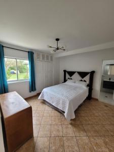 Postel nebo postele na pokoji v ubytování Casa amplia con Piscina privada y a pasos de la playa + 15 fotografií