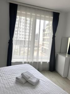 Ένα ή περισσότερα κρεβάτια σε δωμάτιο στο Sunflower Apartments