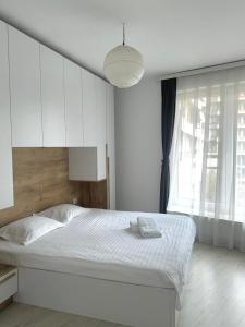 Ένα ή περισσότερα κρεβάτια σε δωμάτιο στο Sunflower Apartments