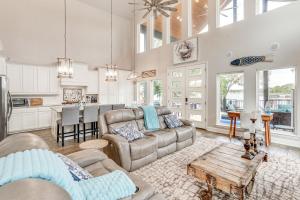 a living room with a couch and a table at Private Dock and Yard! Modern Getaway in Mabank in Enchanted Oaks