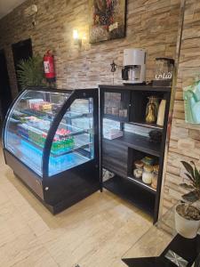 an empty refrigerator with its door open in a kitchen at Roaa Apartments in Al Qunfudhah