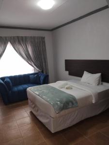 Ένα ή περισσότερα κρεβάτια σε δωμάτιο στο Mthembu Executive Accomodation