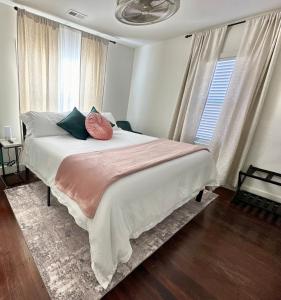 a bedroom with a large bed with two pillows on it at POEs Place in Panguitch