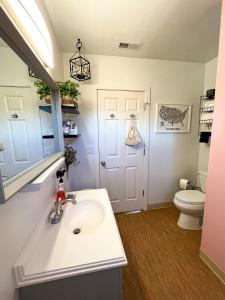 a bathroom with a sink and a toilet at POEs Place in Panguitch