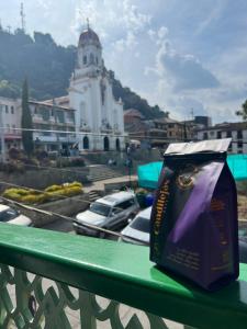 a bag of food sitting on a rail on a balcony at Candilejas in Fredonia