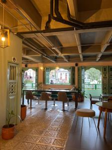 a room with a pool table and chairs and windows at Candilejas in Fredonia