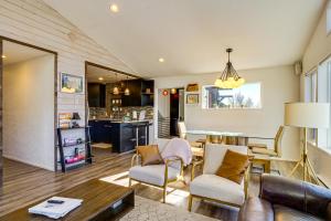 a living room with a table and chairs at Quiet Alma Home with Deck - 20 Mi to Breckenridge! in Alma