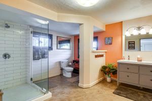a bathroom with a shower and a toilet and a sink at Quiet Alma Home with Deck - 20 Mi to Breckenridge! in Alma +32 photos