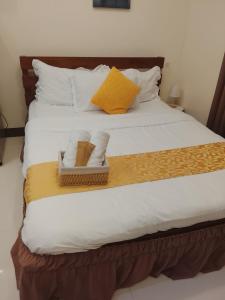 Postel nebo postele na pokoji v ubytování Nazario's Cozy Haven