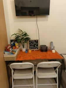 TV a/nebo společenská místnost v ubytování Nazario's Cozy Haven