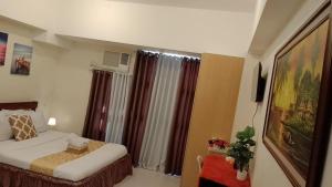 Postel nebo postele na pokoji v ubytování Nazario's Cozy Haven