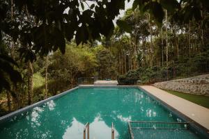 Bazén v ubytování Greenex farm Resort nebo v jeho okolí