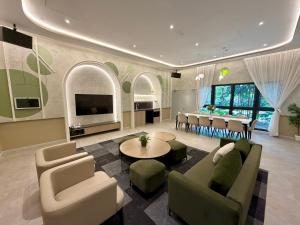 a living room with a couch and a table at Agile bukit bintang trx by klcc sky view in Kuala Lumpur