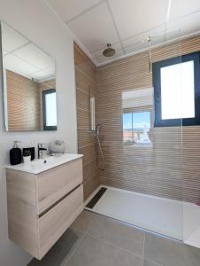a bathroom with a shower and a sink and a tub at R-40-E Esplendor in Los Montesinos