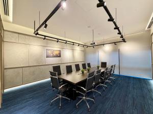 a conference room with a long table and chairs at Agile bukit bintang trx by klcc sky view in Kuala Lumpur +29 photos