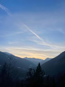 a view of a valley with mountains in the distance at Appartamento vicino a Bormio in Valdisotto +7 photos