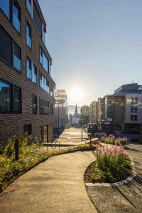 a walkway in the middle of a city with buildings at Modern Apartment in Tromsø Center in Tromsø