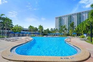 a swimming pool in front of a building at Ocean Reserve 1524 in Miami Beach