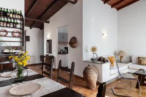 a living room with a table and chairs at Villa Roberta in Monte Nai