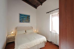 Postel nebo postele na pokoji v ubytování Villa Golfo Aranci