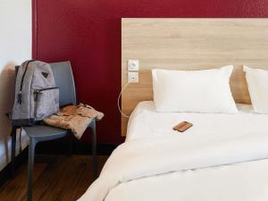 Ένα ή περισσότερα κρεβάτια σε δωμάτιο στο hotelF1 Rouen Zénith Parc Expo