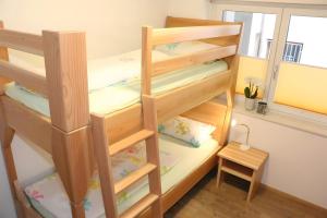 a bunk bed in a room with a window at Haus Beilerstädtle in Oppenau