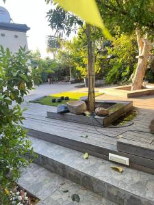 a set of stairs with rocks and a tree at Black chilli accommodation in Brackenfell